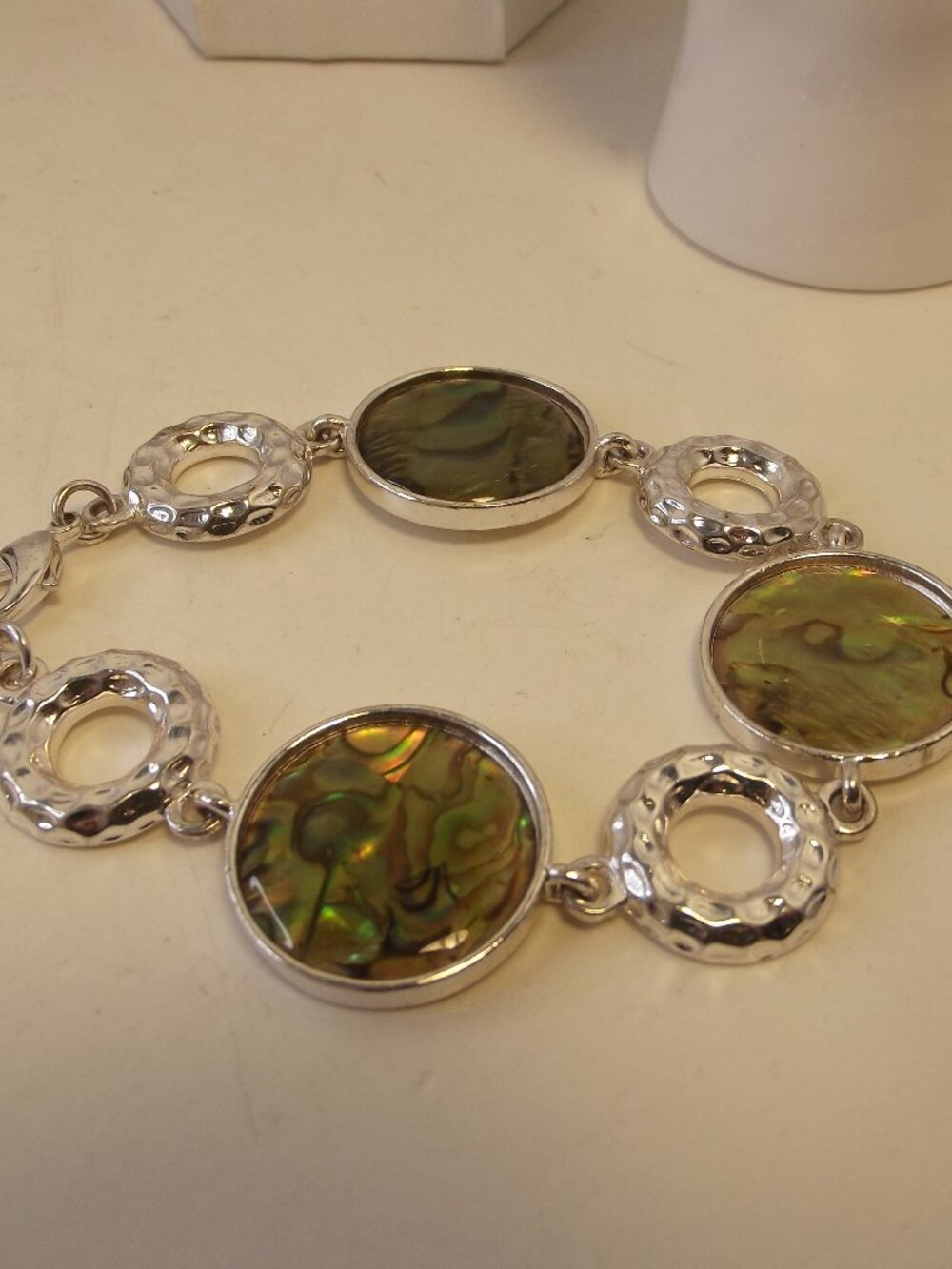 Bracelet of Abalone Shell under Resin and Textured silver tone rings
